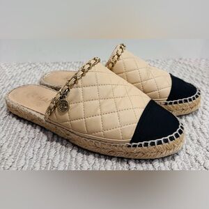 CHANEL Quilted Beige and Black Espadrille Mules with Gold Chain